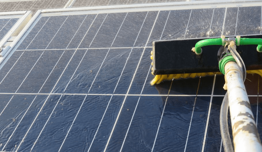 cleaning solar panels by soft brush & water 