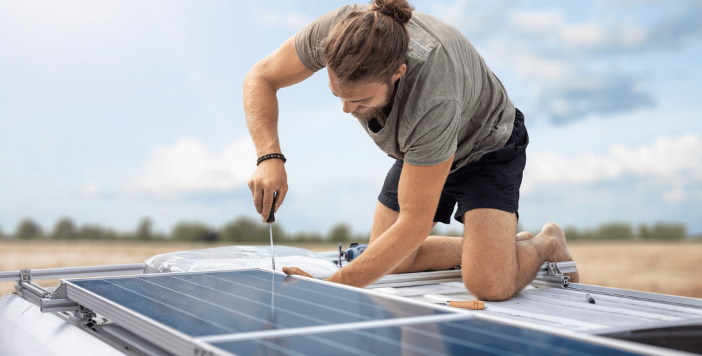 DIY solar panels uk - man installing solar panels